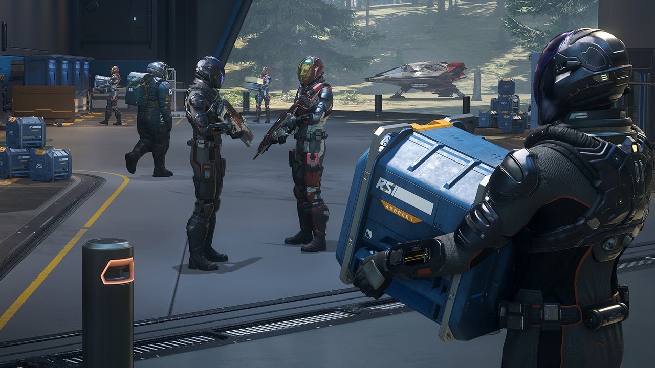 Crews hauling RSI cargo on a landing pad during RSI Discovery Month in Star Citizen